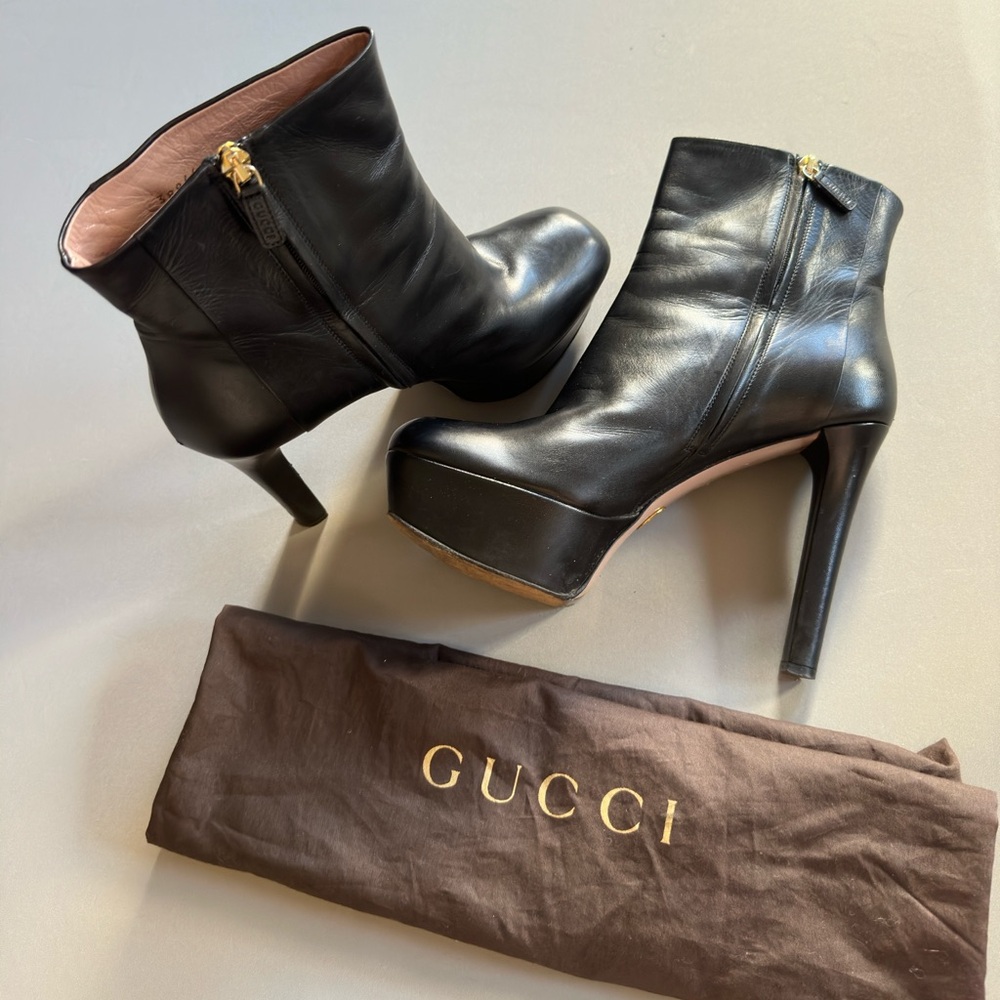 Black Gucci heeled boot. Sleek and unique. FREE BAG